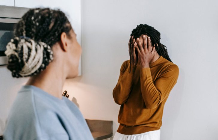 Black couple having conflict at kitchen