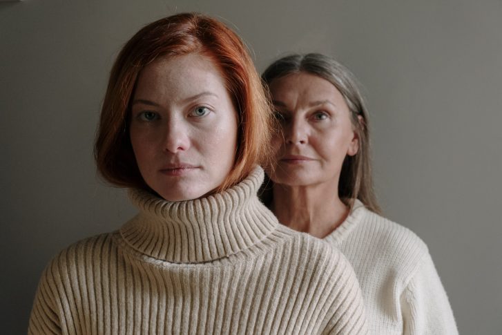 Headshot of mother and daughter in sweaters