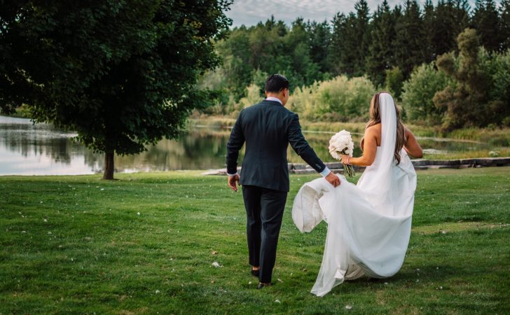 a man and woman walking in a park